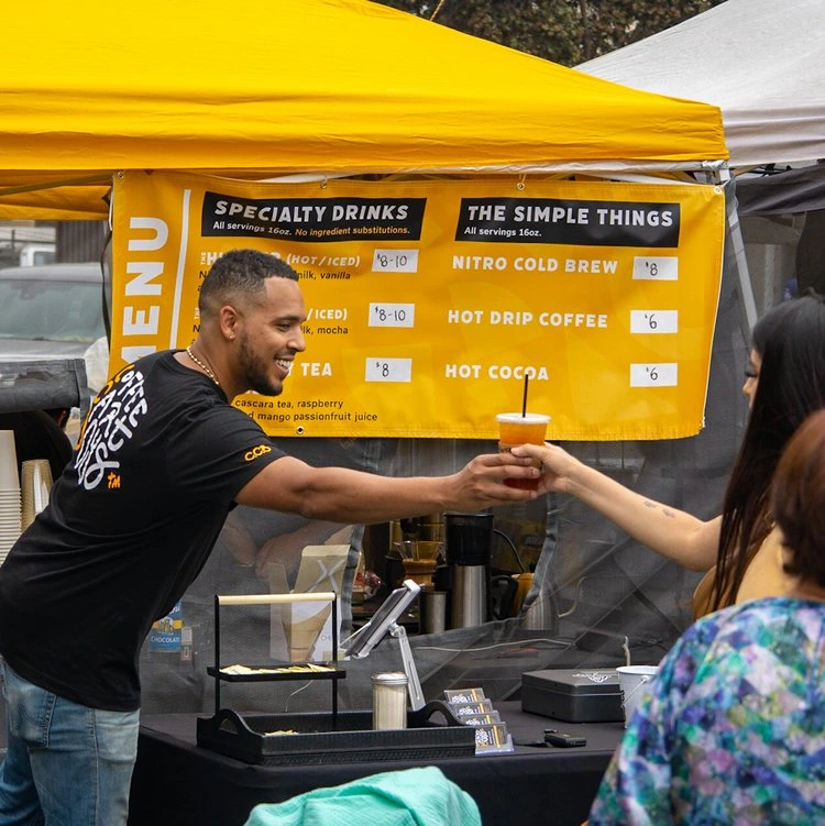 Coffee Cart Boys CEO/Founder Daniel Vasquez serving at a public event in Santa Monica - Specialty Coffee & Tea Catering