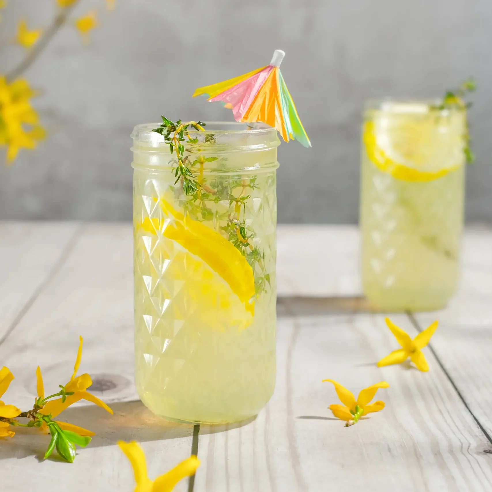 Refreshing cold lemonade in clear glasses