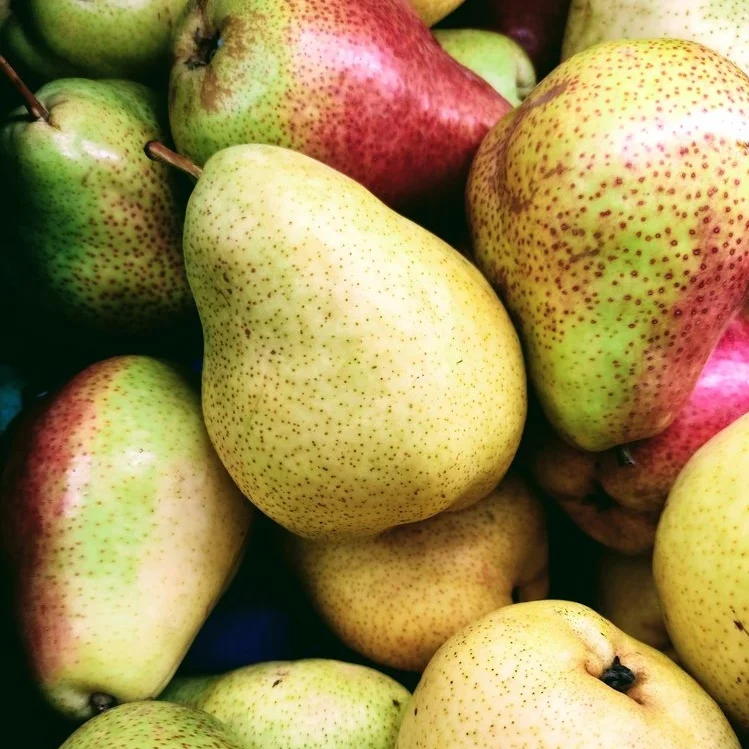 Bushel of green and red pears