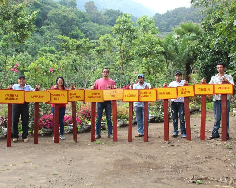 Finca Mierisch team members posing in their varietal garden.