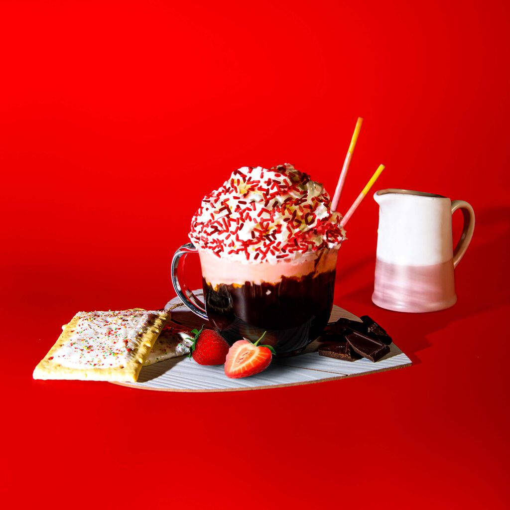 Chocolate-Dipped Strawberry Latte Drink alongside its ingredients: pop-tarts, strawberries, chocolate and cream.