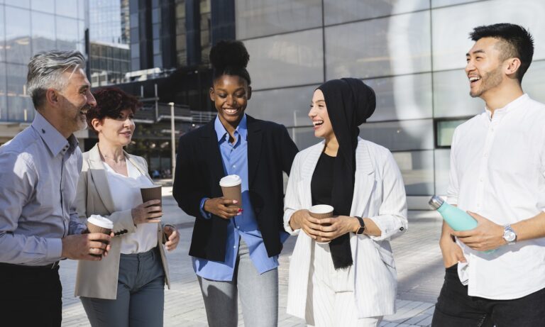 Employees outside of their workplace drinking coffee together - Specialty Coffee & Tea Catering