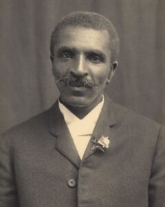 Famous inventor, George Washington Carver posing for a black and white portrait in circa 1910. - "The Black History of Coffee"