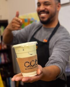 Daniel serving up a fresh, ice-cold matcha latte for one of the teachers at Learning Works Charter School.